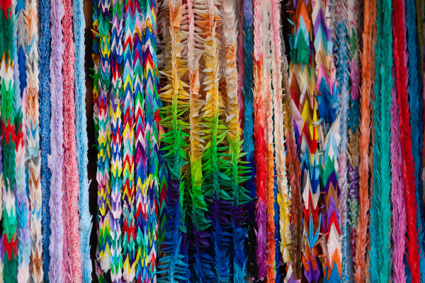 Thousands of paper cranes people folded and hung symbolizing their aspirations of happiness