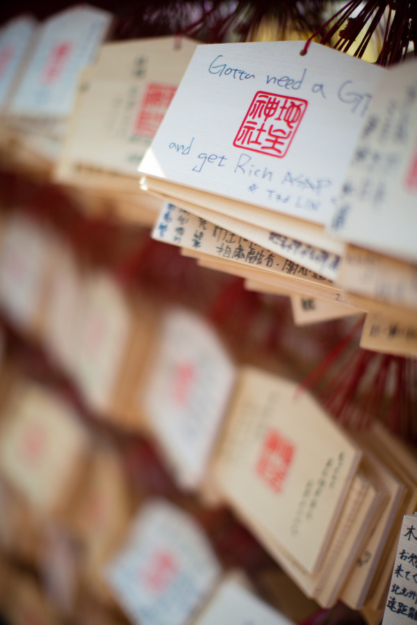 The best wish in the bunch..."gotta need a girlfriend and get rich ASAP." Depending on the girl, he/she may have those in the wrong order :) You can buy these wooden plaques and write your wishes on them. Once a month the temple burns them so your wish comes true. 